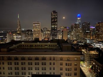Illuminated buildings in city at night