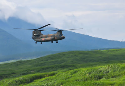 Helicopter flying over land