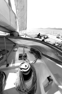 High angle view of sailboat sailing in sea against clear sky