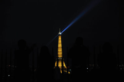 Silhouette of statue at night