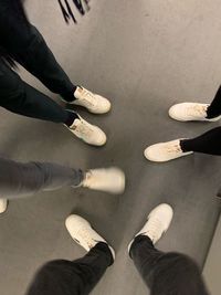 Low section of people standing on floor