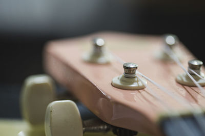 Close-up of guitar on table