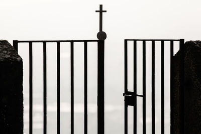 Close-up of metal railing against building