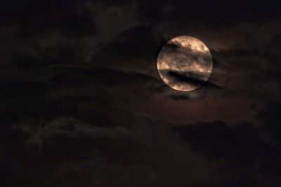 Low angle view of moon against sky at night