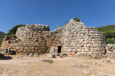 Old ruins against clear blue sky