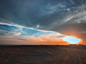 Scenic view of field against sky during sunset