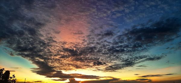 Low angle view of dramatic sky during sunset