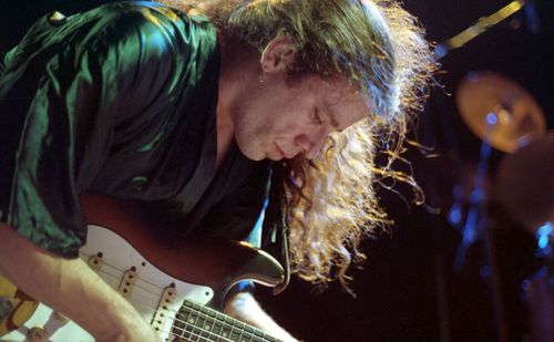 Portrait of man playing guitar
