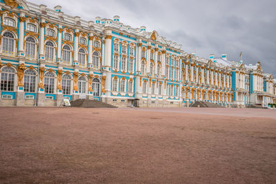 Low angle view of building against cloudy sky