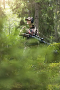 Woman hunting in forest