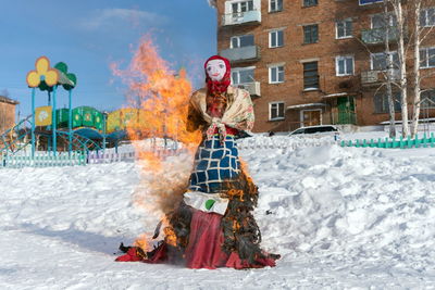 Effigy of the shrovetide in russian folk costume is burned in the traditional national holiday.