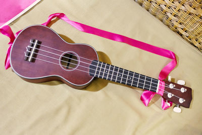High angle view of guitar on table