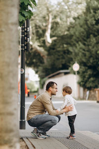 Full length of father with son