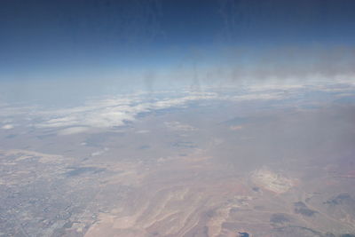 Aerial view of landscape against sky during winter