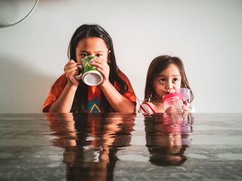 Portrait of a girl drinking water