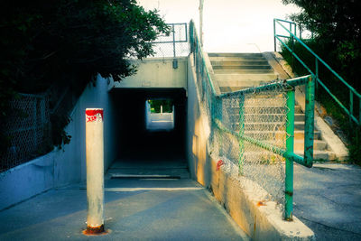 Road by building against sky