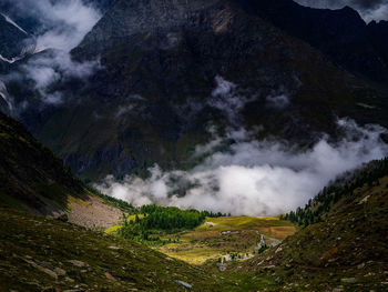 Scenic view of waterfall against sky