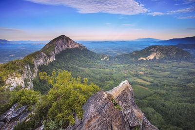 Scenic view of mountain against cloudy sky