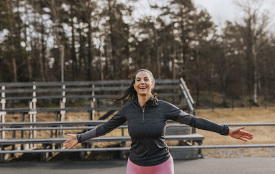 Woman exercising at running track