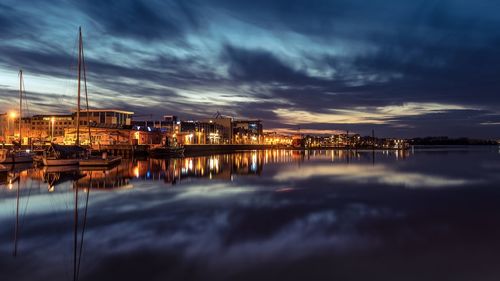 Reflection of illuminated buildings in water at night