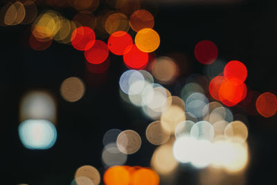 Defocused image of illuminated christmas lights at night