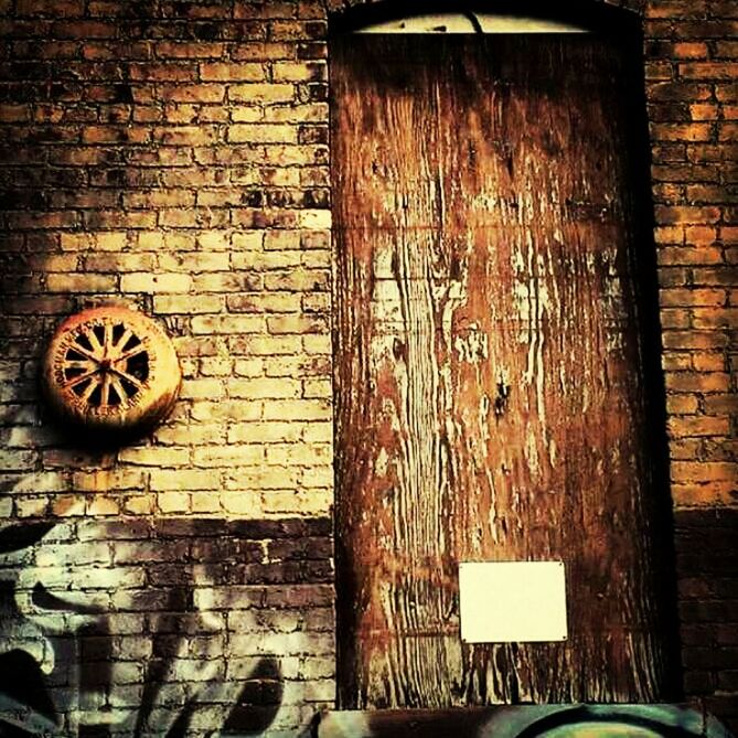 WEATHERED BRICK WALL WITH BRICK WALL