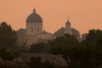 Historic building against sky during sunset