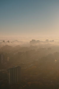 Aerial view of townscape against sky during sunset