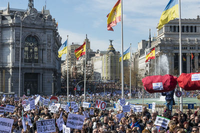 People in front of city