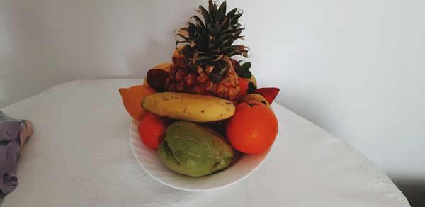 Close-up of fruits in plate on table