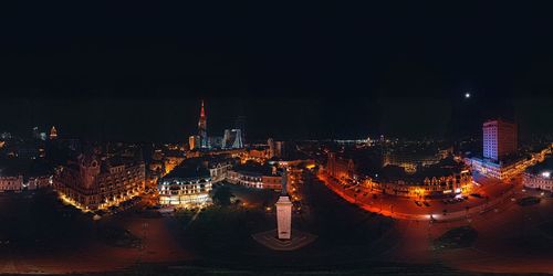 High angle view of illuminated buildings in city at night