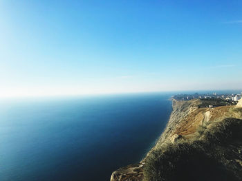 Scenic view of sea against clear blue sky