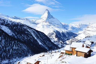 Scenic view of snow covered mountains