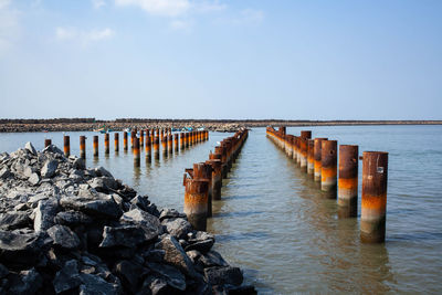 Pier over sea against sky