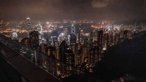 Aerial view of city lit up at night