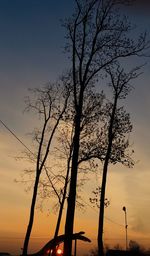 Silhouette bare tree against sky during sunset