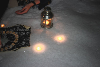 Low section of person on illuminated table