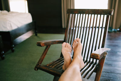 Low section of a woman with legs crossed at ankle