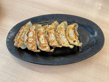 High angle view of meat in plate on table