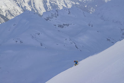 Man skiing on snowcapped mountain