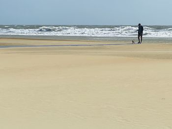 Full length of woman walking on beach