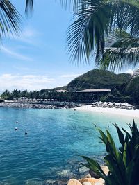 Scenic view of swimming pool by sea against sky