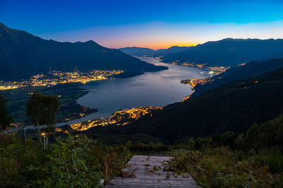 Lake como, photographed by gera lario, in the evening. view of towns and the upper lake mountains.