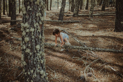 Full length of child in forest