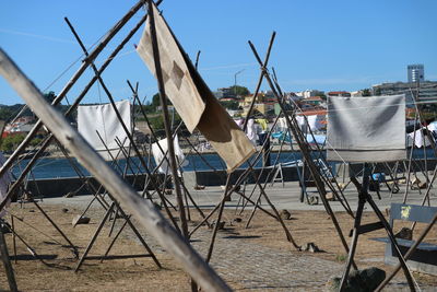 Sailboats on beach against sky