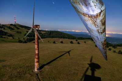 People on landscape against sky