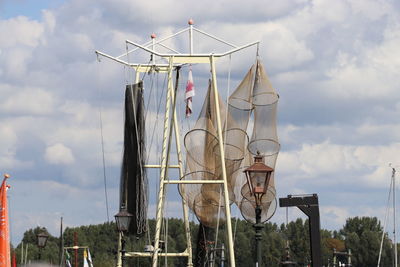 Low angle view of telephone pole against sky