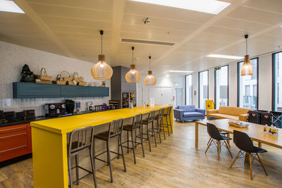 Empty chairs and tables in cafe