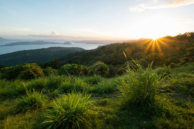 Scenic view of landscape against sky during sunset