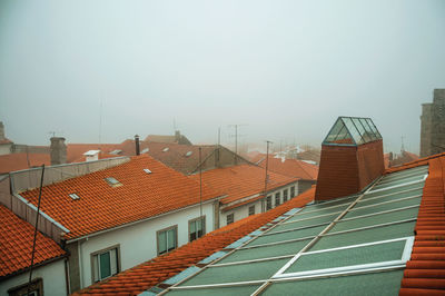 Houses against sky in city